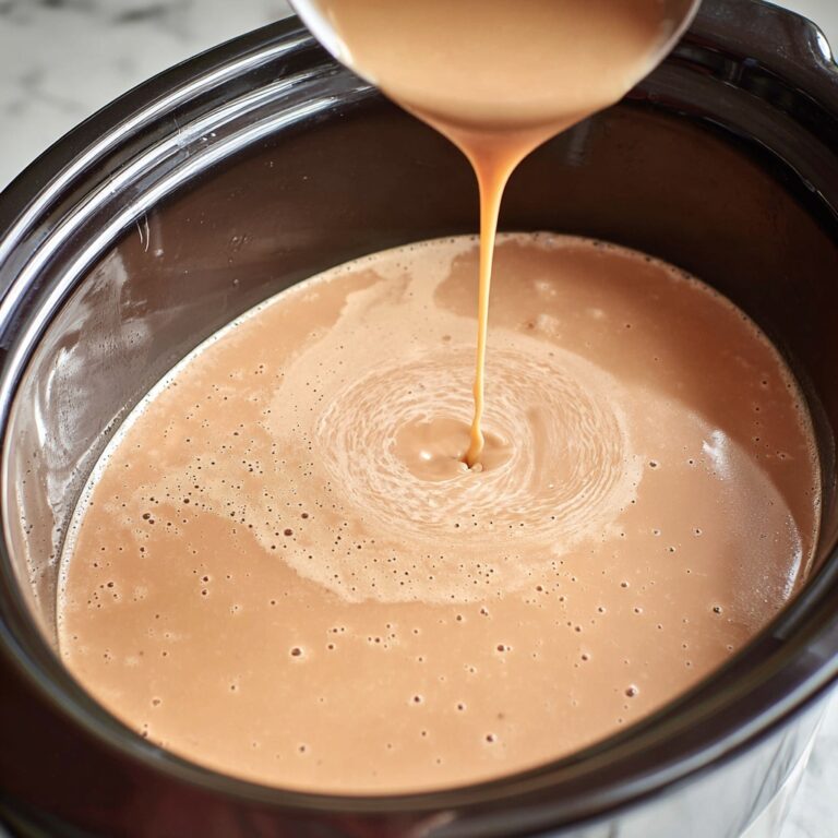 Overnight Croissant Breakfast Casserole with Sausage, Cheddar, and Creamy Gravy Recipe